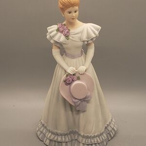 Elegant Porcelain Figurine with Purple Accents